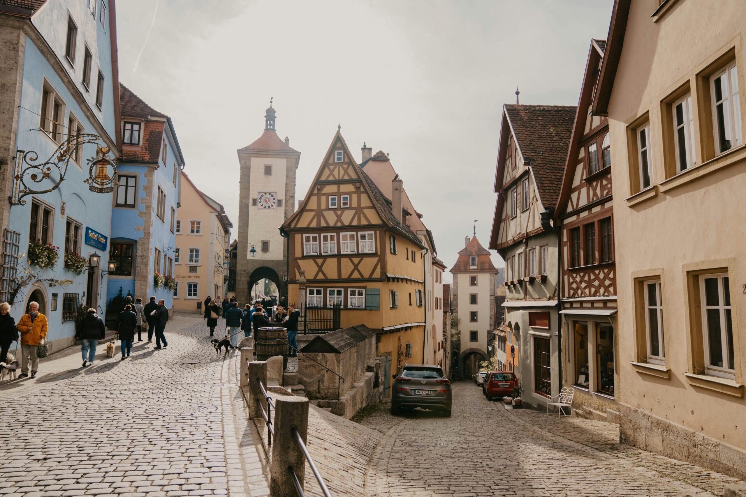 Explore the quaint cobblestone streets and historic architecture of Rothenburg Ob Der Tauber, Germany.