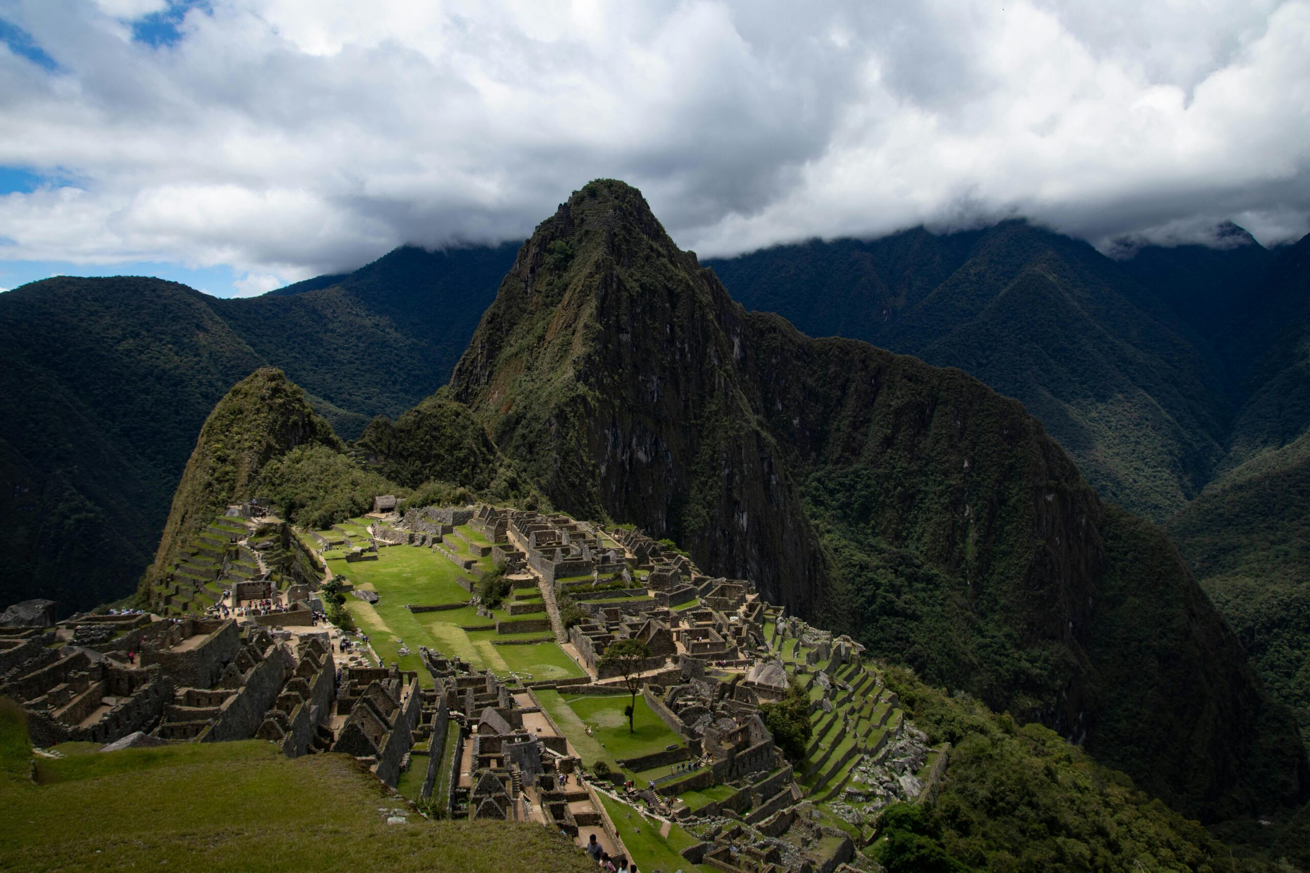 Stunning view of the ancient Incan citadel Machu Picchu surrounded by lush Andean mountains.